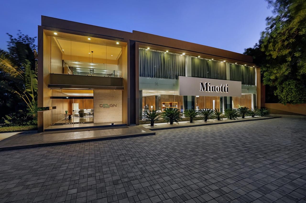 Minotti monobrand showroom in Ahmedabad at dusk, with the Design Italiano entrance to the left