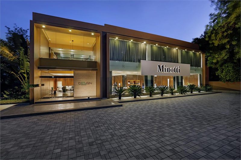 Exterior of the Minotti monobrand showroom in Ahmedabad, illuminated at dusk